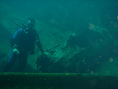 Dr. A next to a Mitsubishi A6M Zero that is inside a cargo ship in Truk Lagoon!
